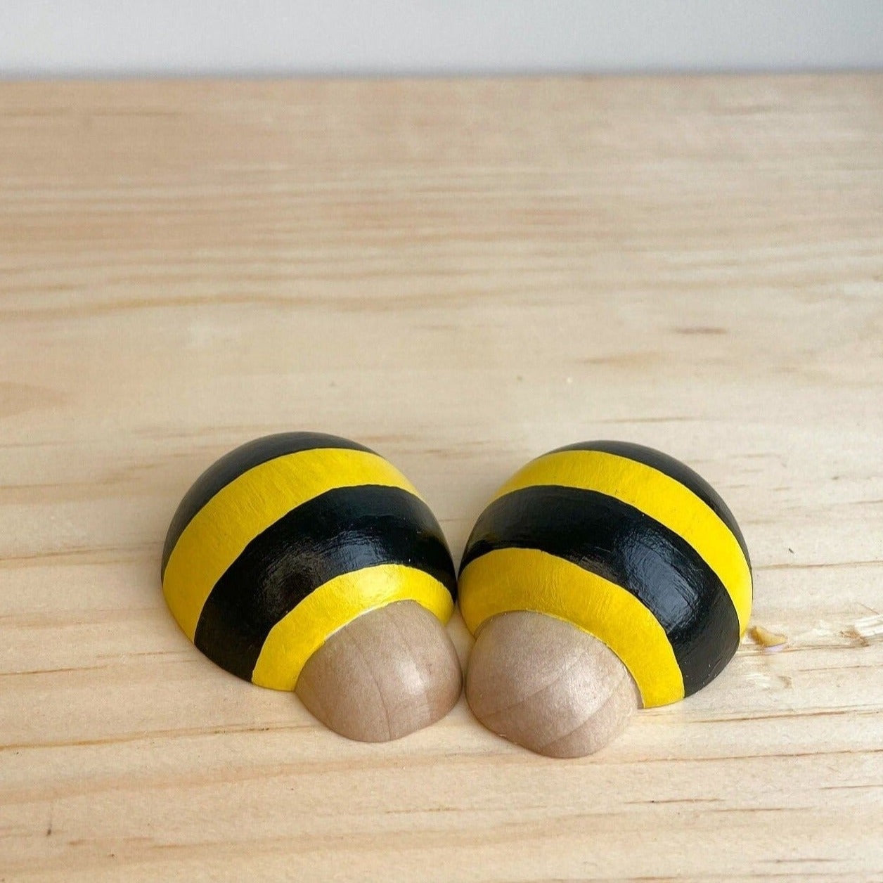 2 wooden bees